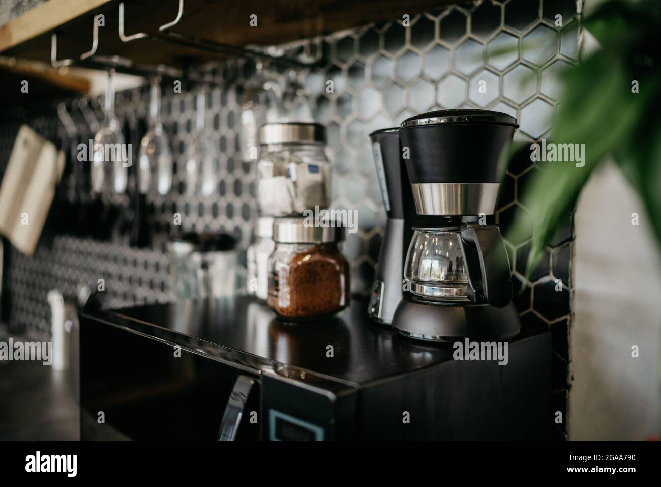 interior of cafe and blurred background with coffee machine. Coffee maker on a black worktop in