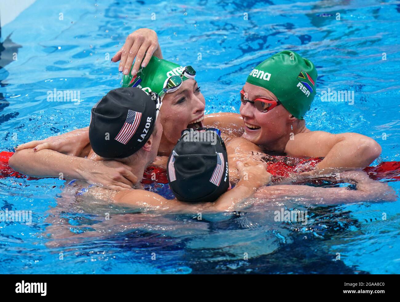 South Africa's Tatjana Schoenmaker congratulated by USA's Annie Lazor and Lilly King after victory in the Women's 200m Breaststroke Final at Tokyo Aquatics Centre on the seventh day of the Tokyo 2020 Olympic Games in Japan. Picture date: Friday July 30, 2021. Stock Photo