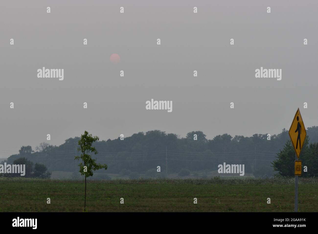 Smoky haze over Cedar Falls, IA due to wildfires in Southern Canada and Western United States.  Photos taken in the evening of July 29, 2021 Stock Photo