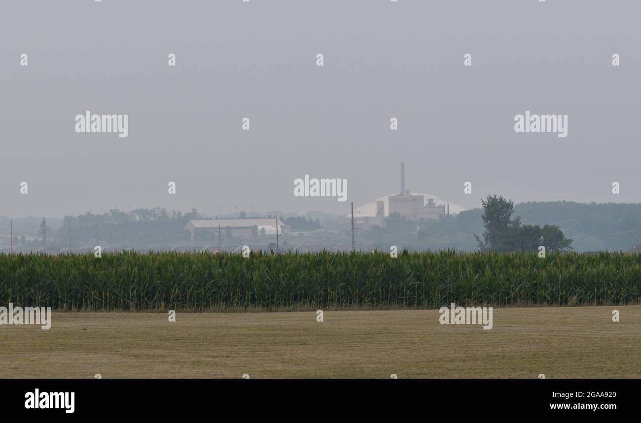 Hazy view of the University of Northern Iowa power plant in Cedar Falls, IA due to smoke from the wildfires in Southern Canada and Western U.S. July29 Stock Photo