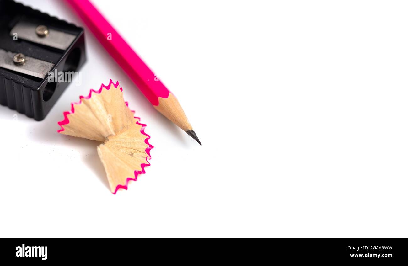 A Freshly Sharpened Pencil and Sharpener Isoalted on a White Background Stock Photo