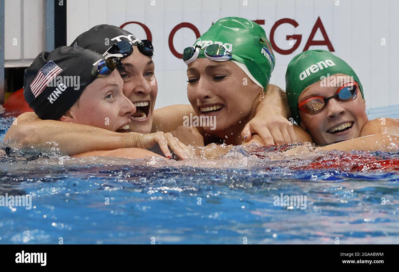 Tokyo, Japan. 29th July, 2021. South Africa's Tatjana Schoenmaker (second from right) hugged by USA's Lilly King (L) Silver medal, 2:19.92, Annie Lazor, Bronze medal, 2:20.84, and teammate Kaylene Corbett (R) after setting a new World Record, 2:18.95, during the Women's 200m Breaststroke Final at the Tokyo Aquatics Centre in Tokyo, Japan on Friday, July 30, 2021. Photo by Tasos Katopodis/UPI Credit: UPI/Alamy Live News Stock Photo