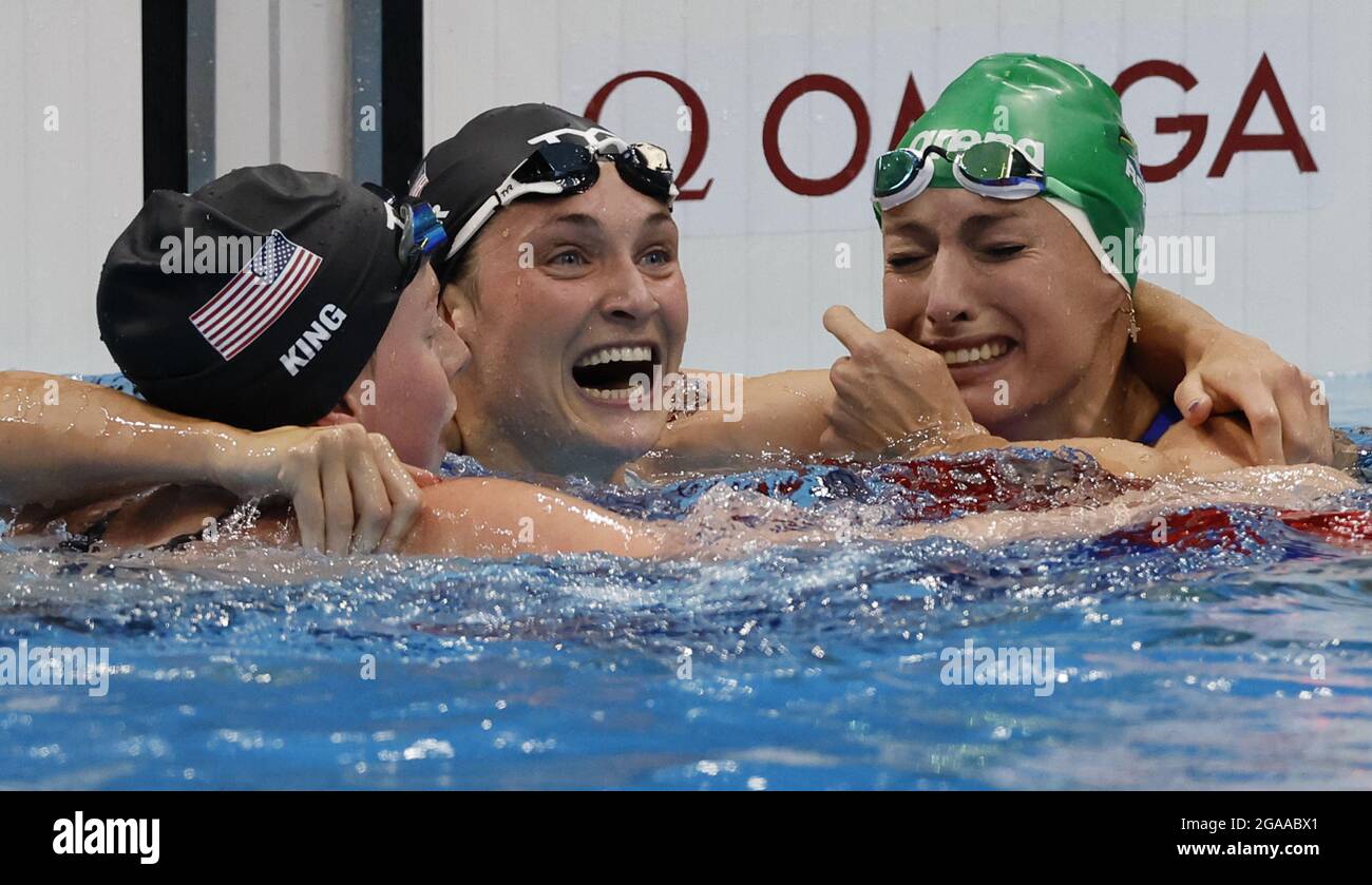 Tokyo, Japan. 29th July, 2021. South Africa's Tatjana Schoenmaker (R) is hugged by USA's Lilly King (L) Silver medal, 2:19.9, and Annie Lazor, Bronze medal, 2:20.84, after setting a new World Record, 2:18.95, during the Women's 200m Breaststroke Final at the Tokyo Aquatics Centre in Tokyo, Japan on Friday, July 30, 2021. Photo by Tasos Katopodis/UPI Credit: UPI/Alamy Live News Stock Photo