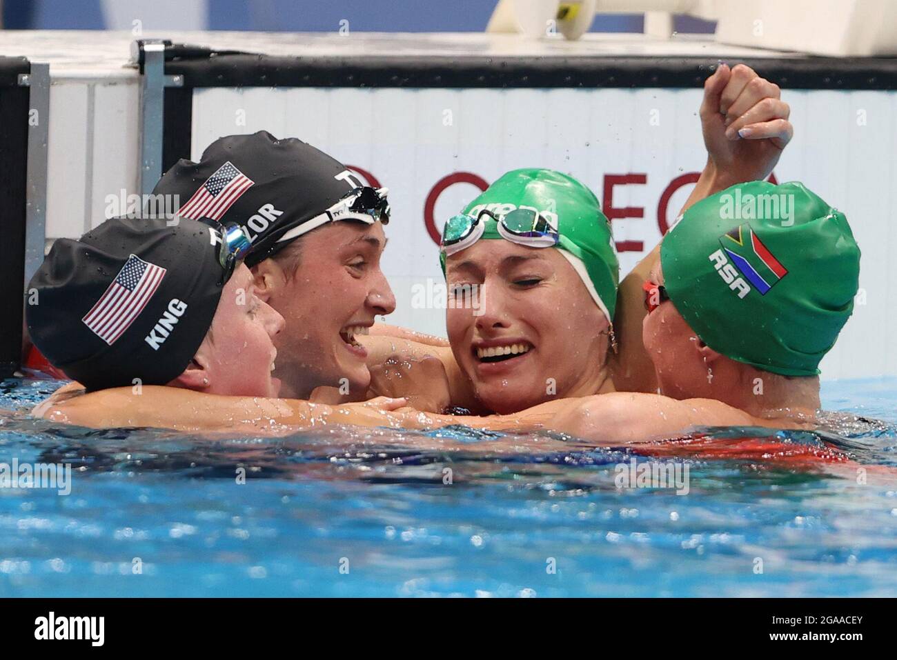 Tokio, Japan. 30th July, 2021. Swimming: Olympics, women, 200 m breaststroke, final at Tokyo Aquatics Centre. Tatjana Schoenmaker (2nd from right) from South Africa cheers for gold next to Lilly King (l) from USA and Annie Lazor (2nd from left) from USA. Credit: Oliver Weiken/dpa/Alamy Live News Stock Photo