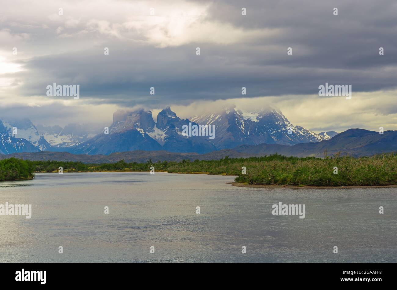 Dramatic clouds and rainy weather above the Cuernos and Torres del Paine Andes peaks in spring, Torres del Paine national park, Patagonia, Chile. Stock Photo