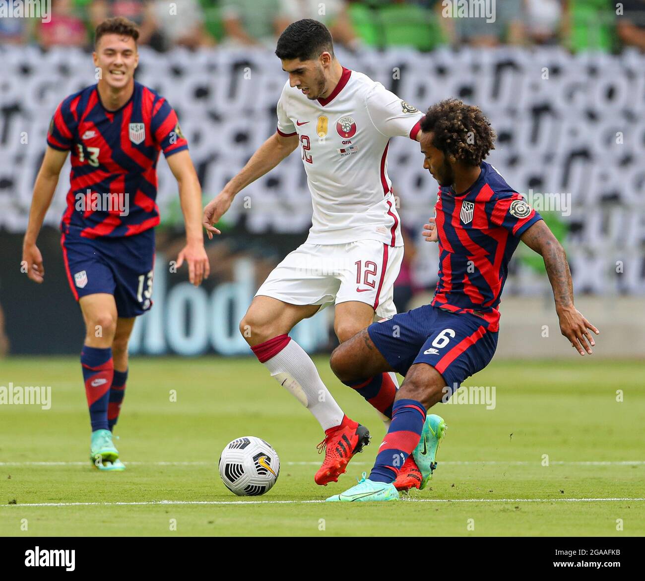 Austin, Texas, USA. 29th July, 2021. Qatar midfielder KARIM BOUDIAF (12) works around United States forward GIANLUCA BUSIO (6) during the first half of the Concacaf Gold Cup semifinal between the United States and Qatar on July 29, 2021 in Austin, Texas. The United States won 1-0. (Credit Image: © Scott Coleman/ZUMA Press Wire) Stock Photo