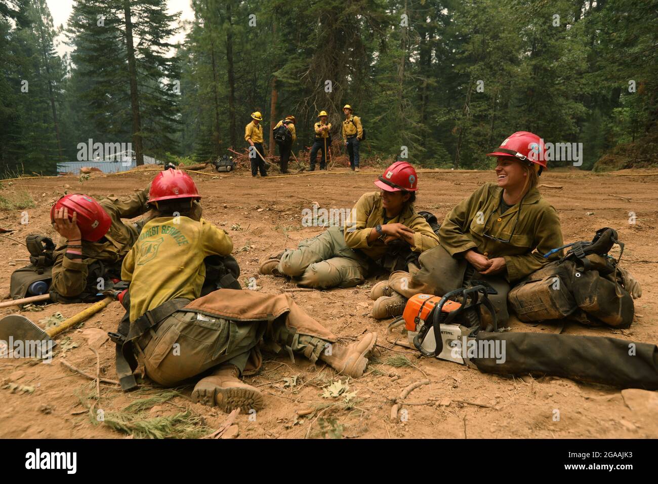 A hotshot crew from Redding with a strike team from the LAFD work the