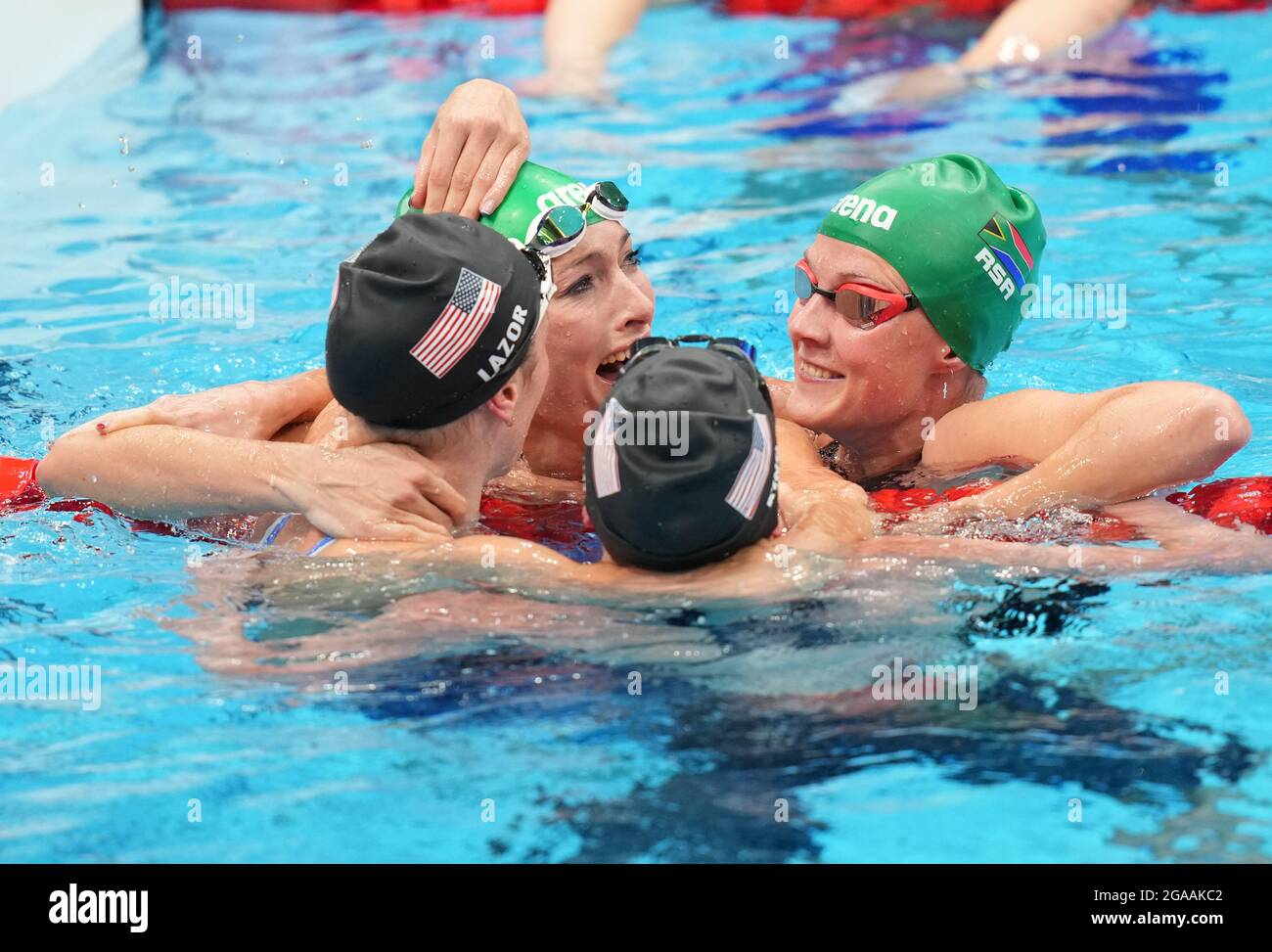 South Africa's Tatjana Schoenmaker congratulated by USA's Annie Lazor and Lilly King and Kaylene Corbett after victory in the Women's 200m Breaststroke Final at Tokyo Aquatics Centre on the seventh day of the Tokyo 2020 Olympic Games in Japan. Picture date: Friday July 30, 2021. Stock Photo