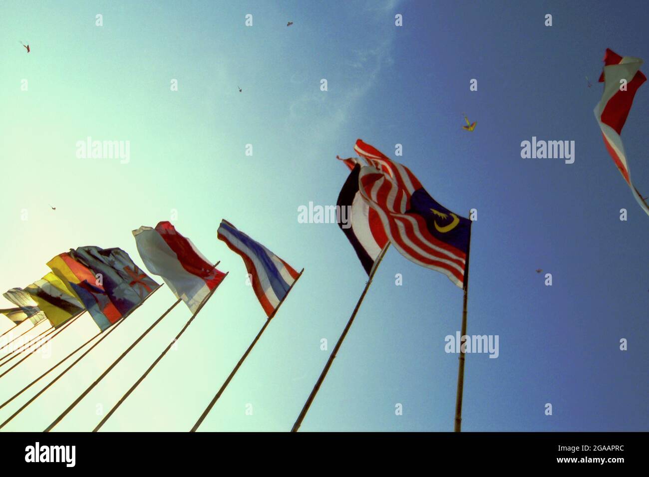 Flags of participating countries during the 2004 Jakarta International Kite Festival that held on July 9-11 at Carnival Beach in Ancol Dreamland, North Jakarta, Jakarta, Indonesia. Stock Photo