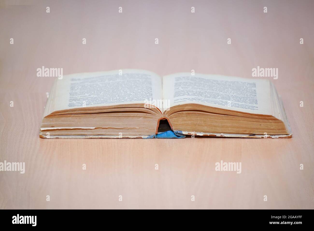 An open book on a wooden table. Selective focus Stock Photo