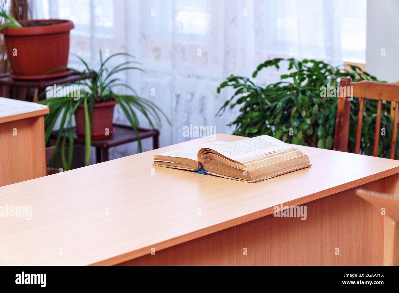 An open book on a wooden table. Selective focus Stock Photo
