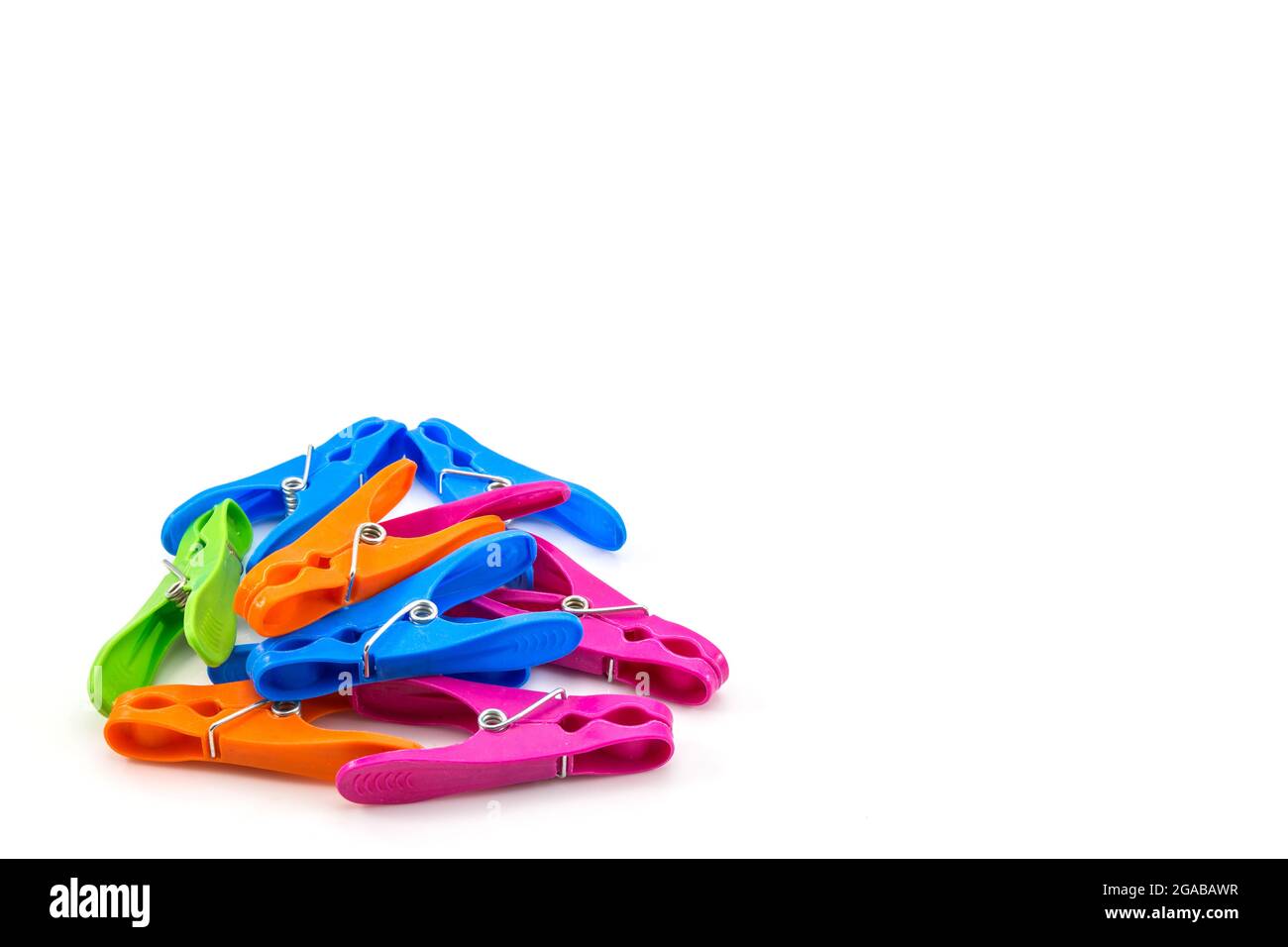 colorful plastic clothes pegs on white background Stock Photo