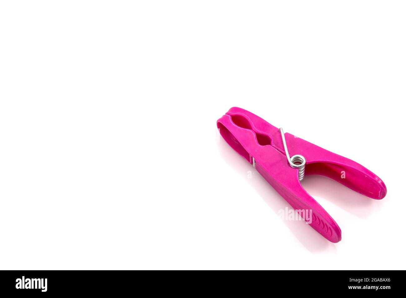 colorful plastic clothes pegs on white background Stock Photo - Alamy