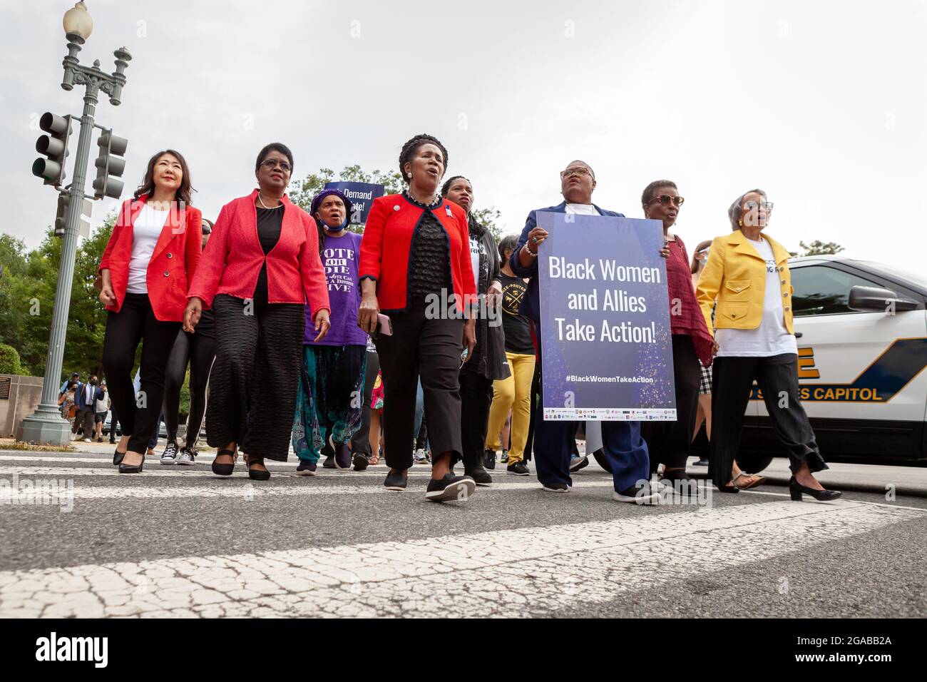 Washington, DC, USA. 29th July, 2021. Pictured: Black Women lead a short march to the Hart Senate Building for a civil disobedience action at a voting rights speak-out event hosted by the National Coalition on Black Civic Participation. Left to right: Rev. Hyepin Im, Rev. Dr. Barbara Williams-Skinner, Faya Toure, Congresswoman Sheila Jackson Lee (D-TX), Rev. Leslie Copeland-Tune, Melanie Campbell, Cora Masters Barry, and Dr. Johnnetta Cole. Credit: Allison Bailey/Alamy Live News Stock Photo