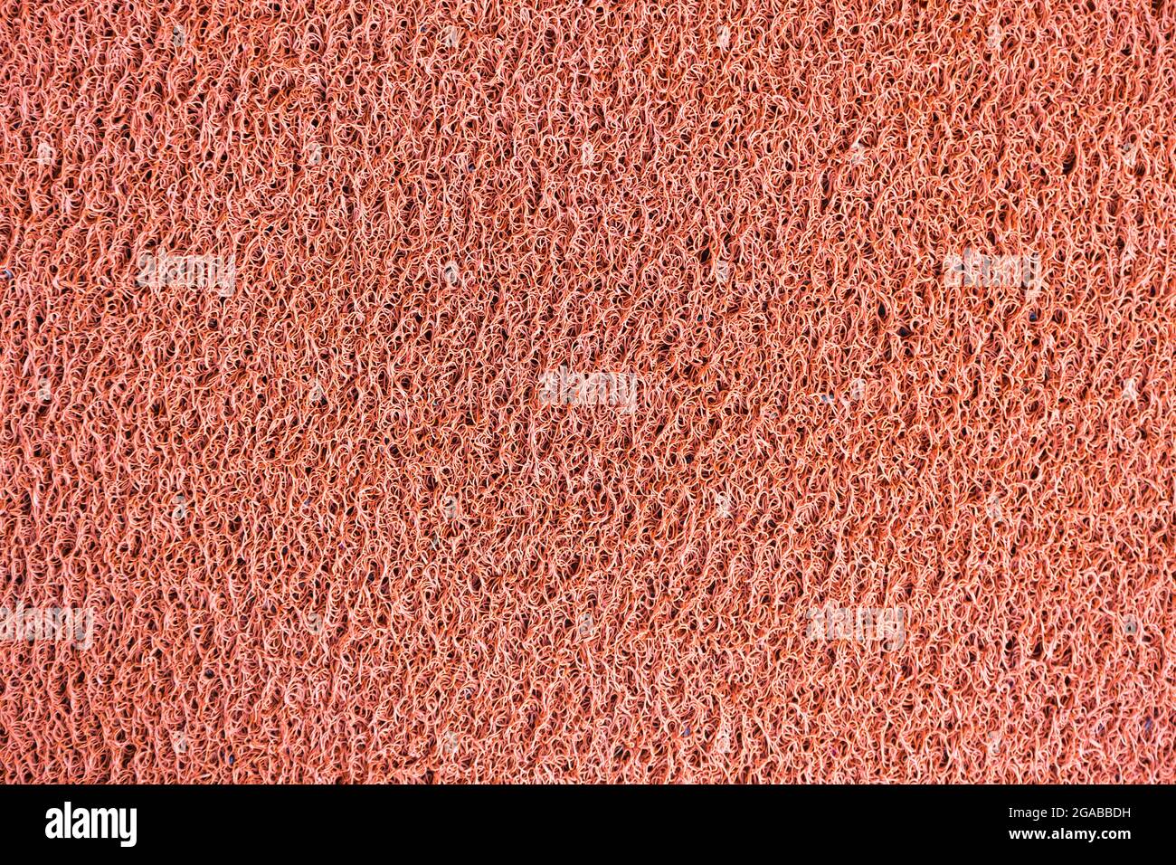 Red vinyl dust trap carpet texture background Stock Photo - Alamy