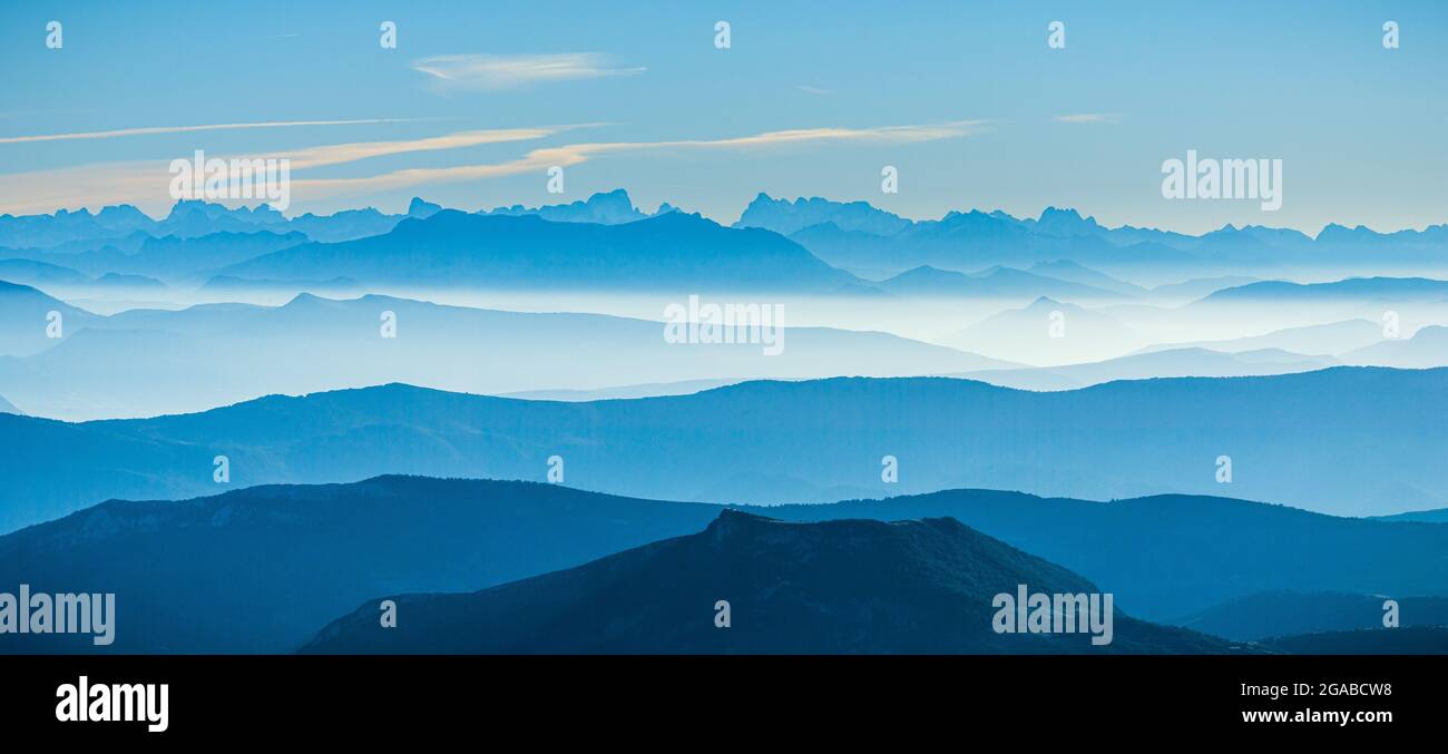 blue sunrise in the French Alps on a misty day, viewed from