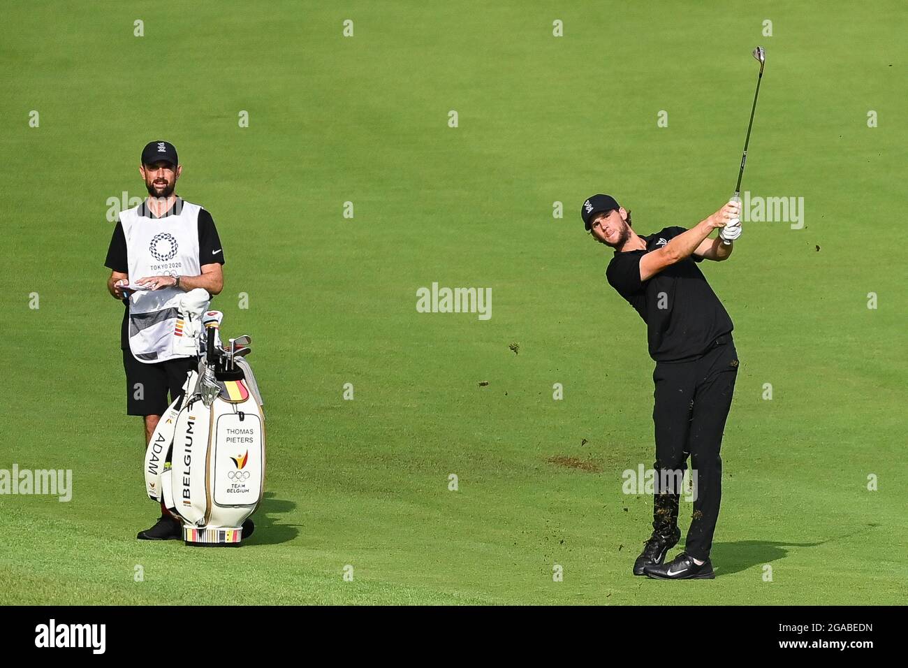 Caddy Adam Marrow and Belgian Thomas Pieters pictured in action during round 2 of the men's Golf Individual Stroke Play on the eighth day of the 'Toky Stock Photo