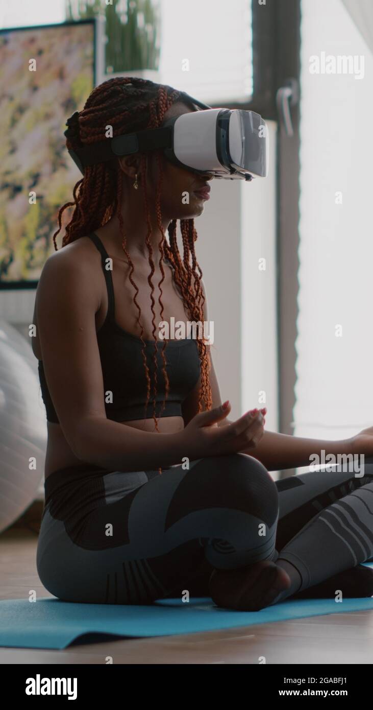 Curated visual reference: Fresh Look at Black Trainer Woman Wearing Virtual Reality Headset While Sitting On