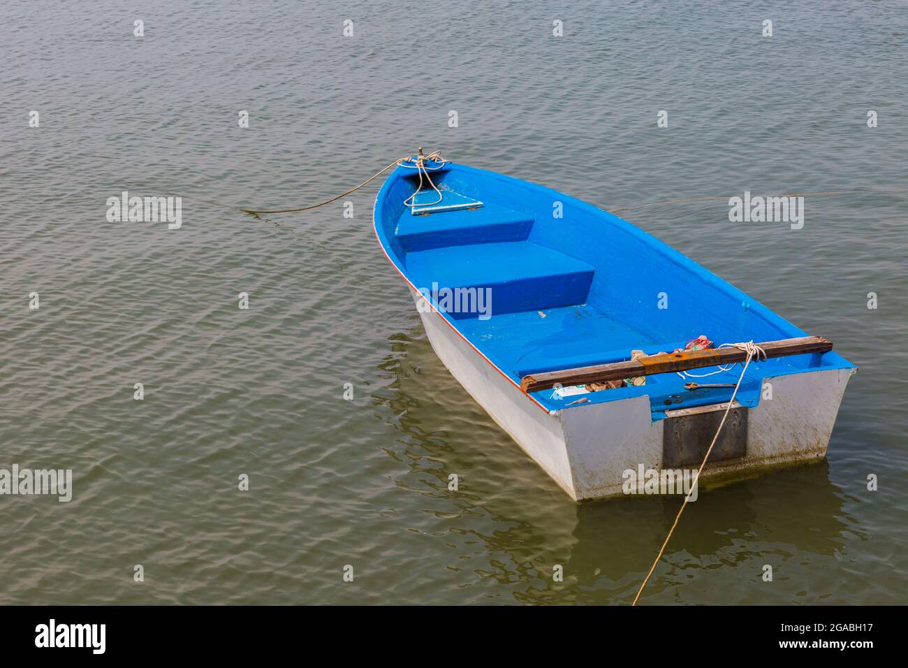 Blue and white old boat at a the beach Stock Photo - Alamy