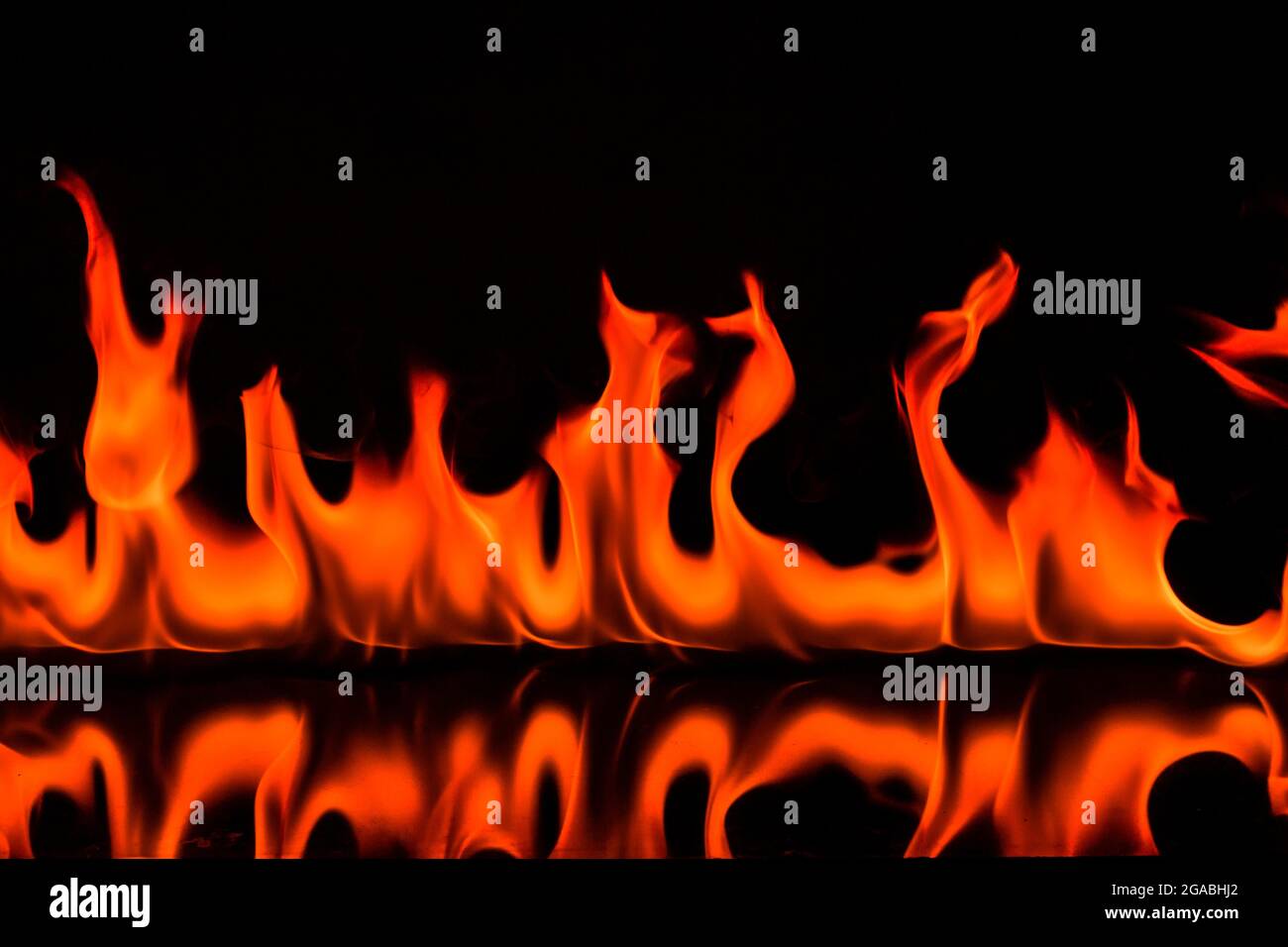 Red Fire flames on black background Stock Photo - Alamy
