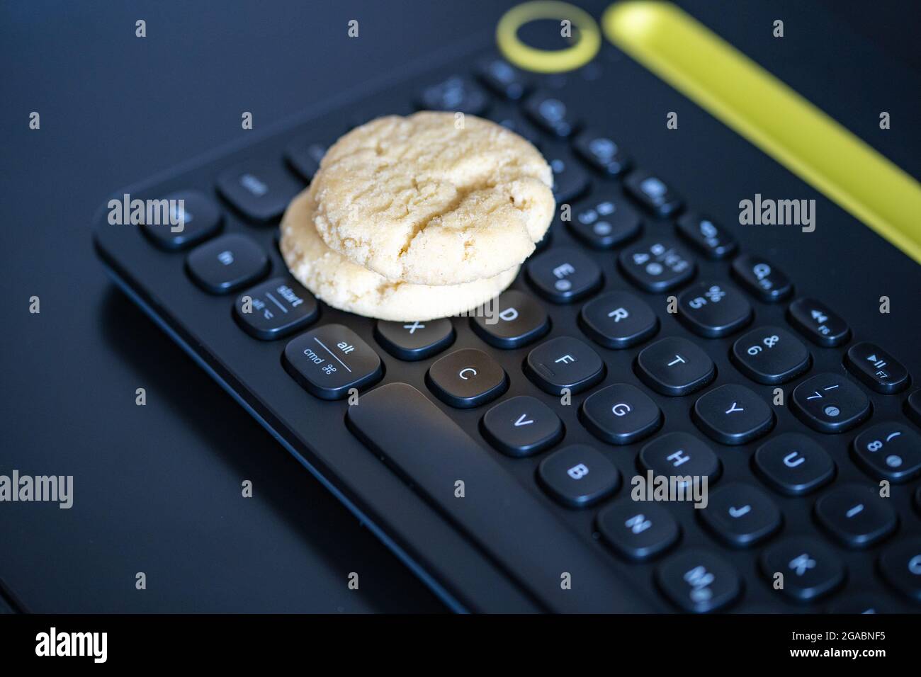 Cookies on a keyboard symbolizing browser cookies on internet. Stock Photo