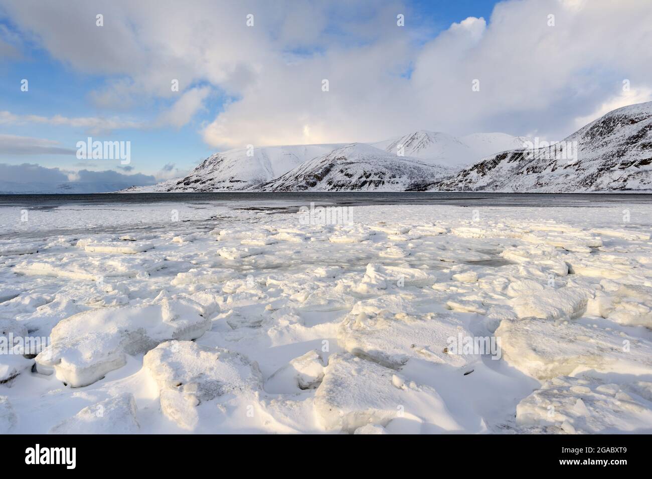 Bay with upcoming ice on the shore, Norway. Stock Photo