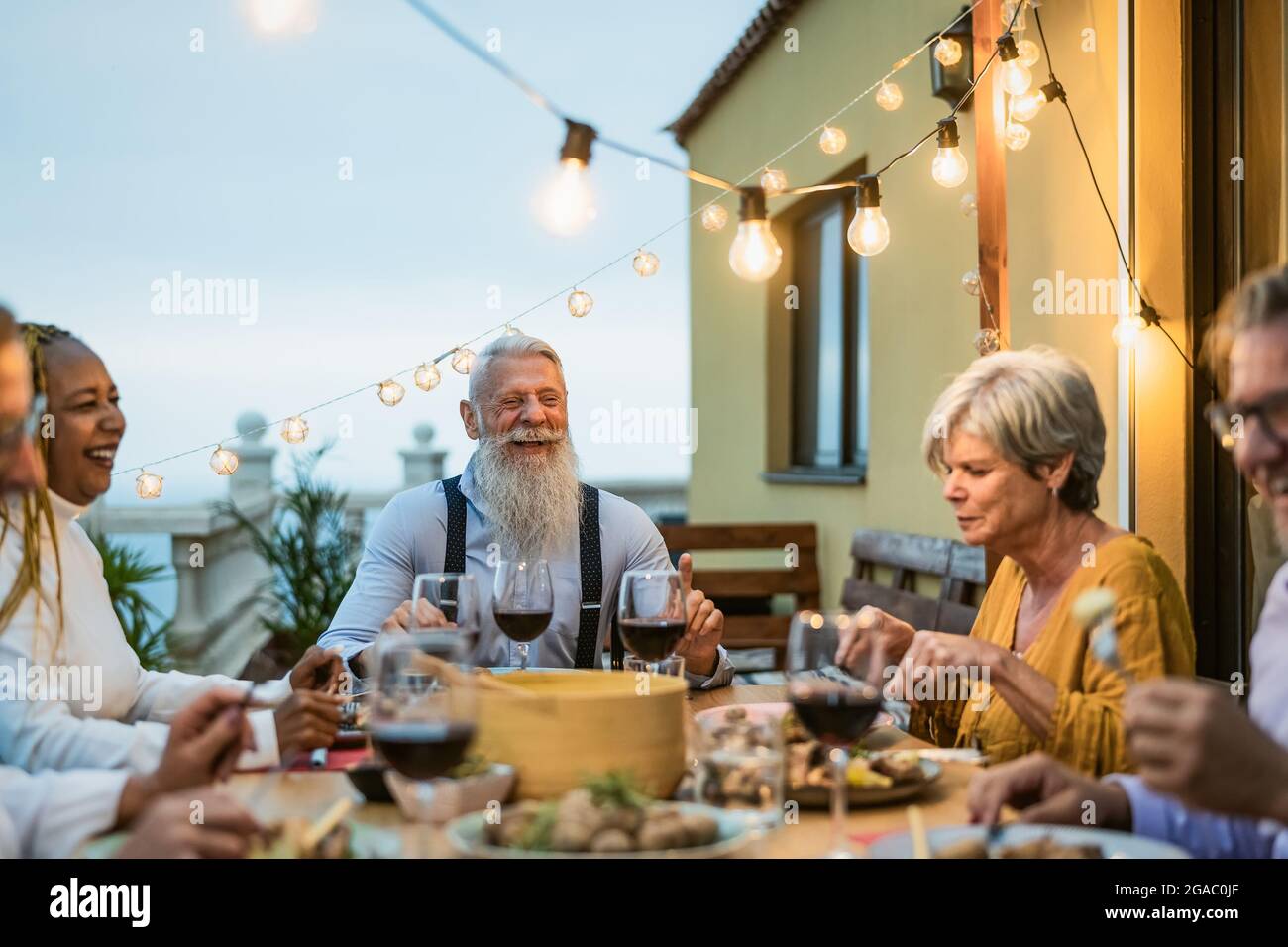 Multiracial group older people smiling hi-res stock photography and ...