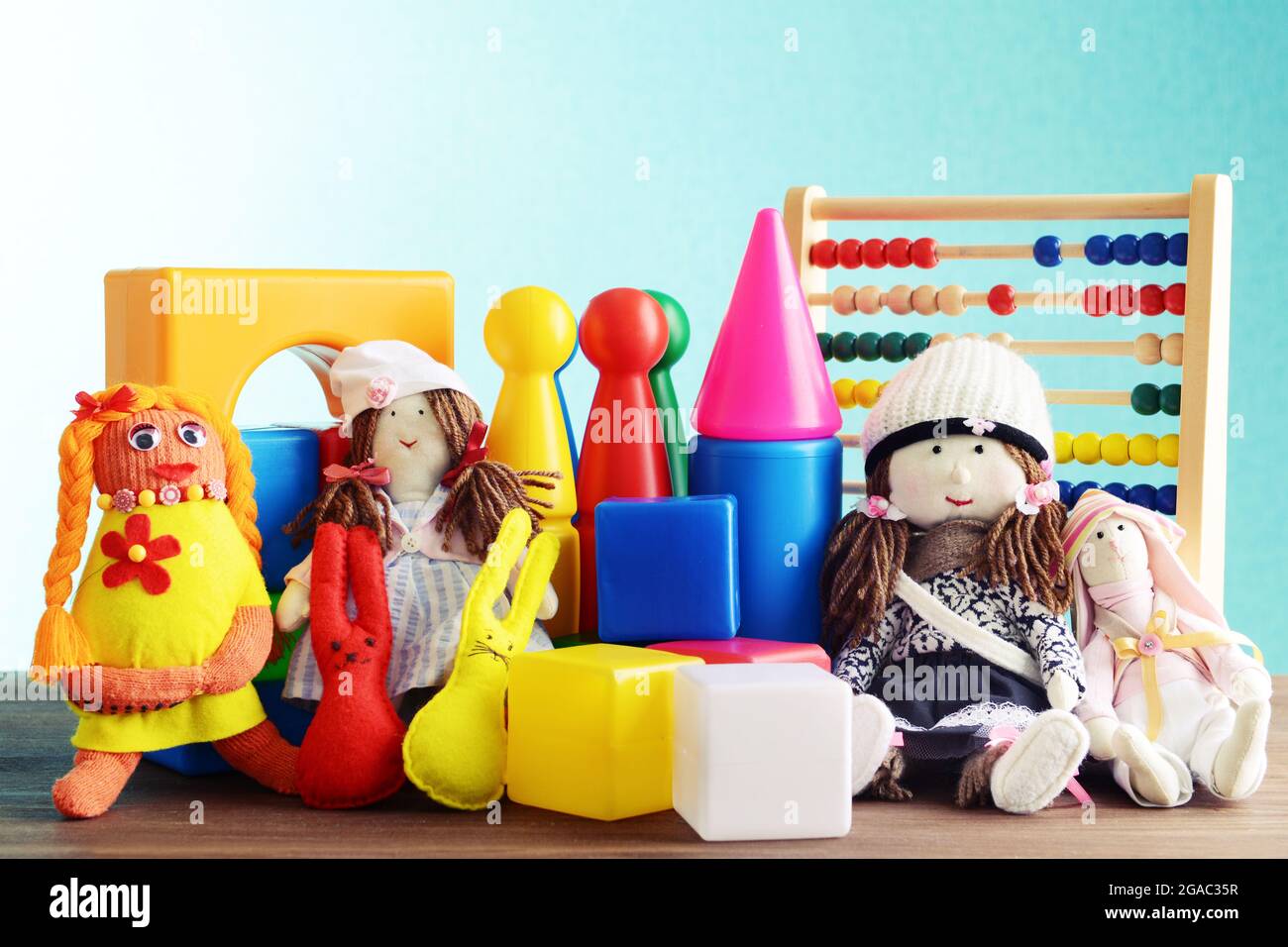 Pile of toys on blue background Stock Photo - Alamy