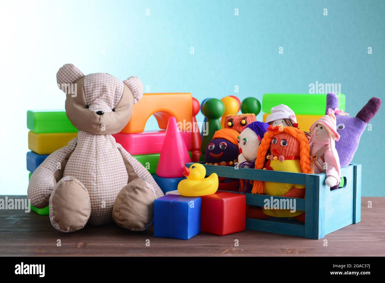 Pile of toys on blue background Stock Photo - Alamy