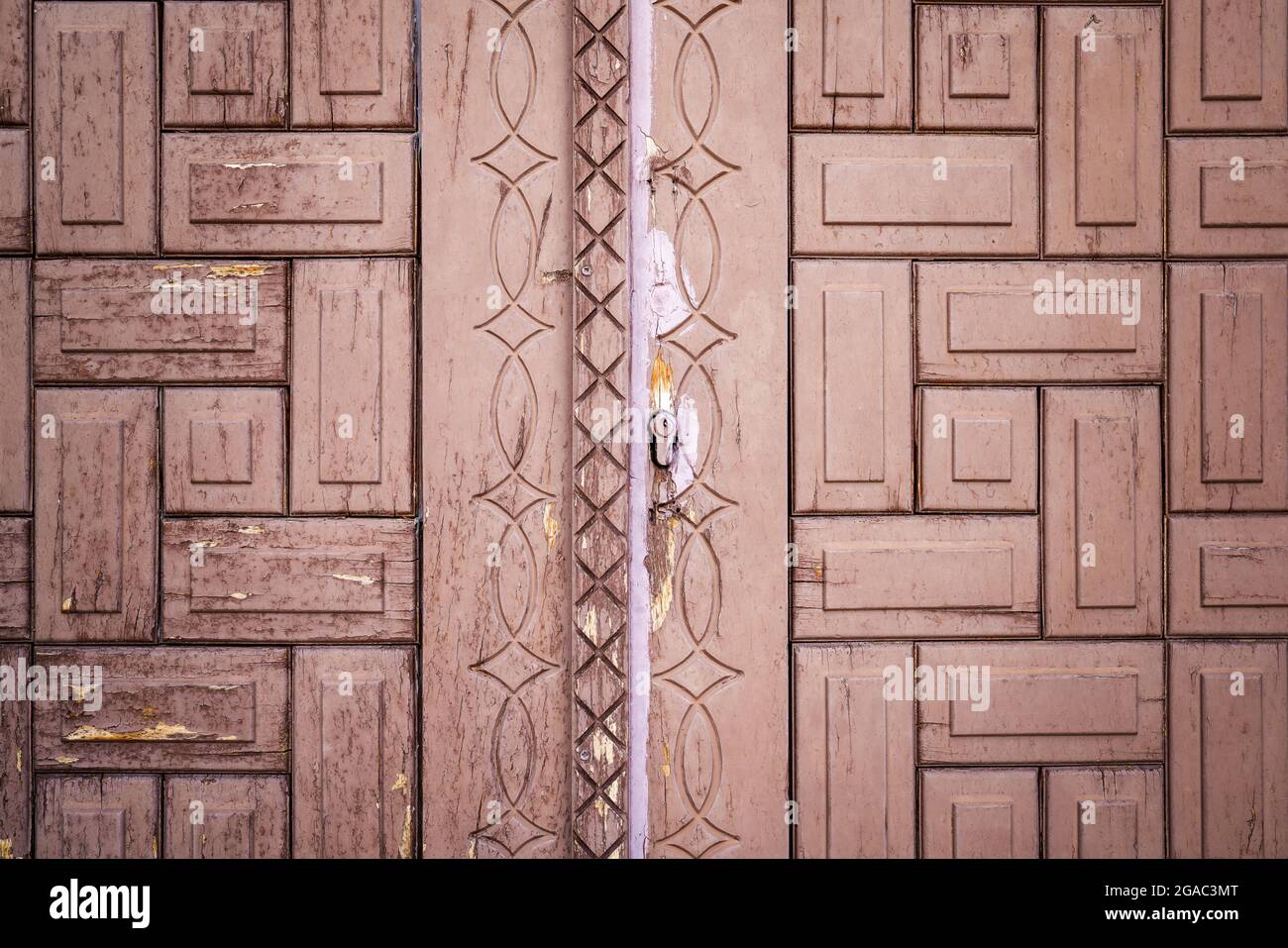 Brown unpainted natural wooden gate with grains and carved patterns for