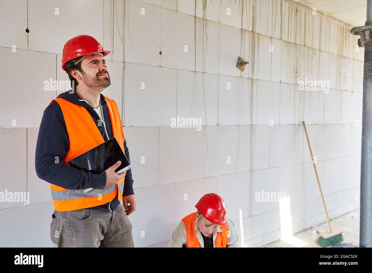 An architect or appraiser finds construction defects during an inspection on the construction site in the shell Stock Photo
