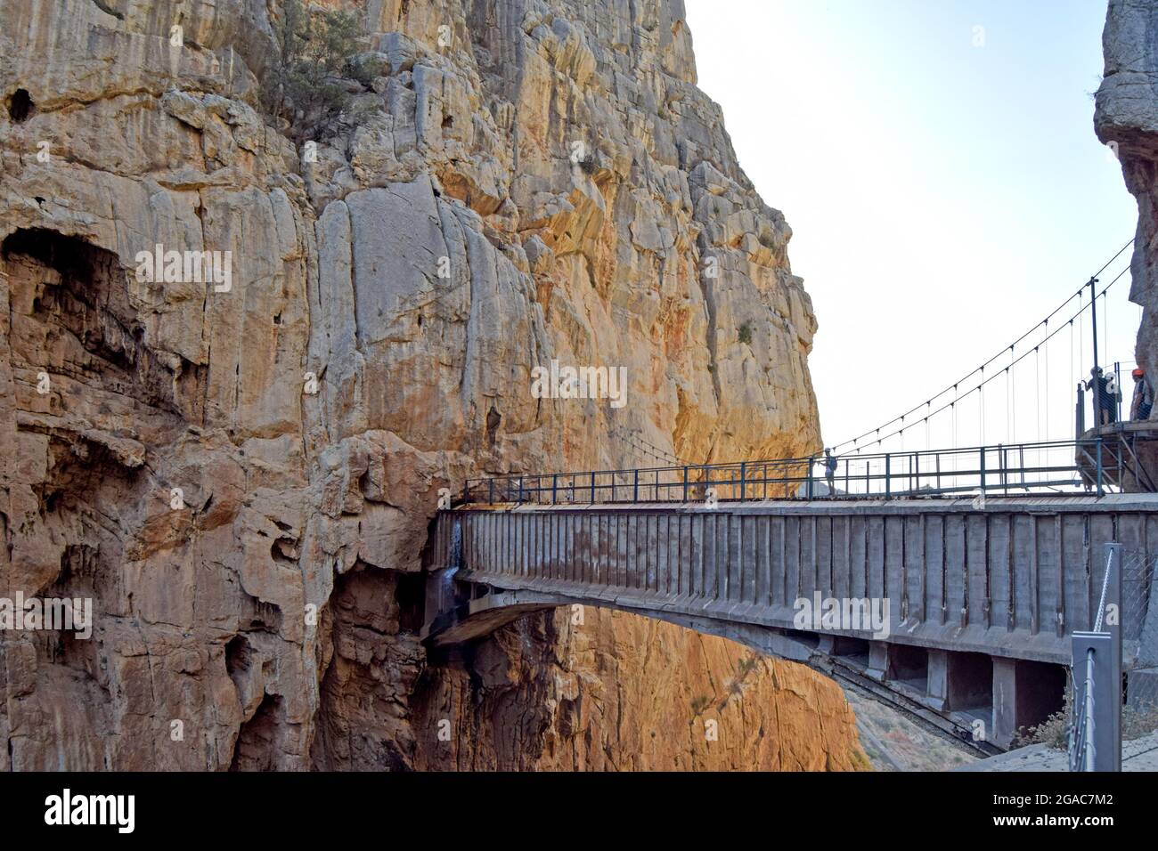 Very dangerous suspension bridge between mountains of the tourist place of Caminito del Rey in