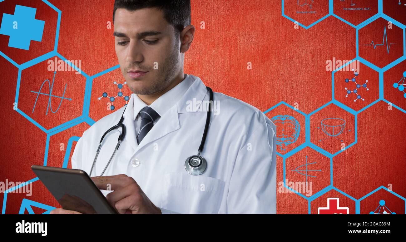 Composition of male doctor using tablet over digital icons on red ...
