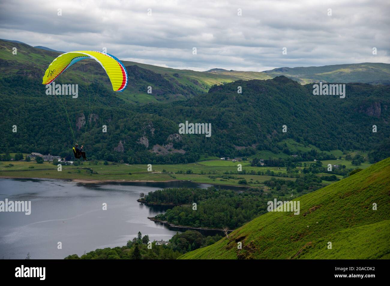 A lone Paraglider above Derwent water in the Lake District, UK Stock Photo