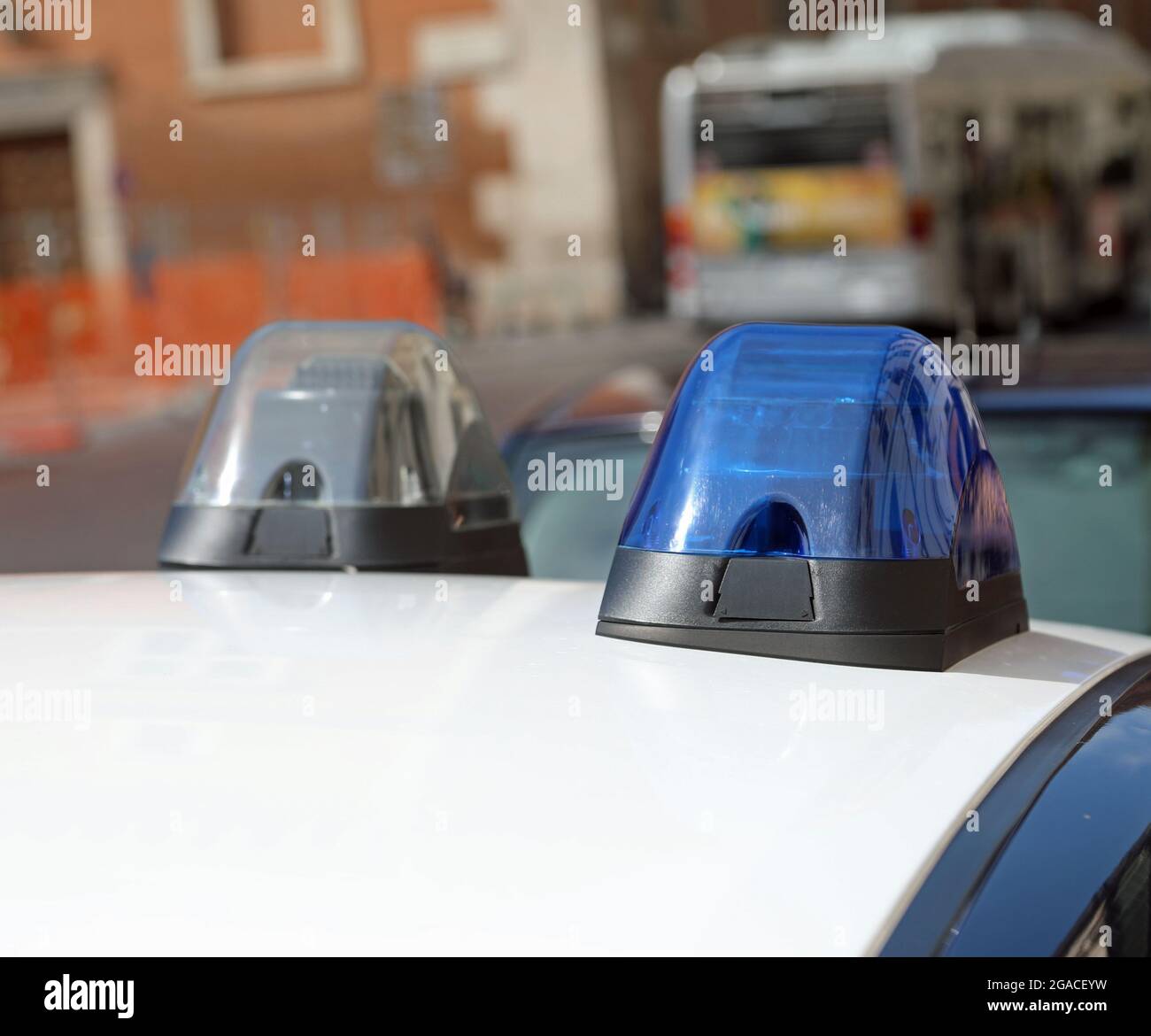 blue flashing siren of police car while patrolling the city Stock Photo