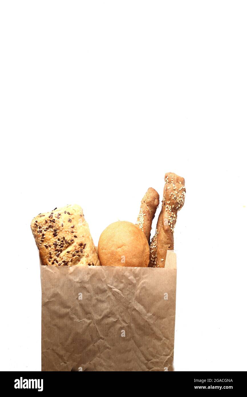 bread in paper bag isolated on white background flat lay. Image ...