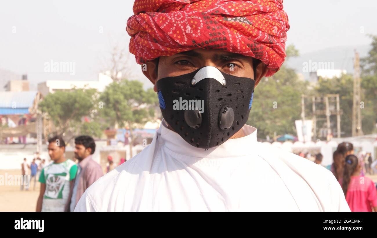 Closeup of an Indian man wearing a black mask Stock Photo - Alamy