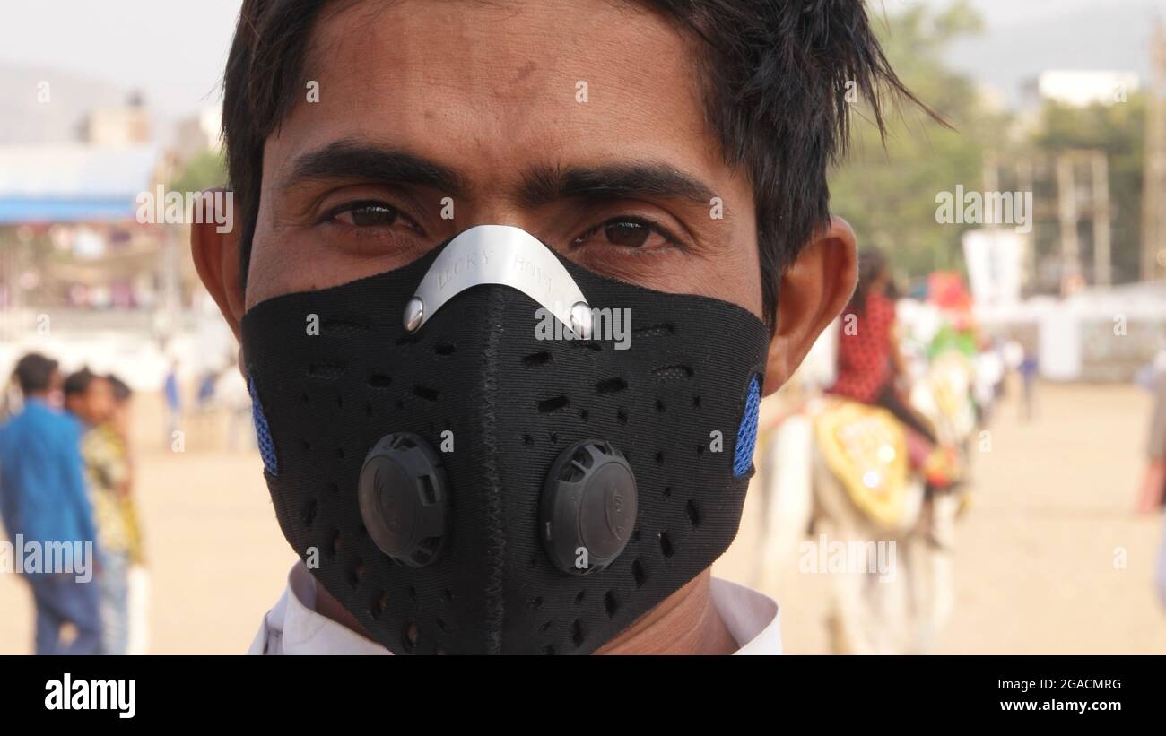 Closeup of an Indian man wearing a black mask Stock Photo - Alamy