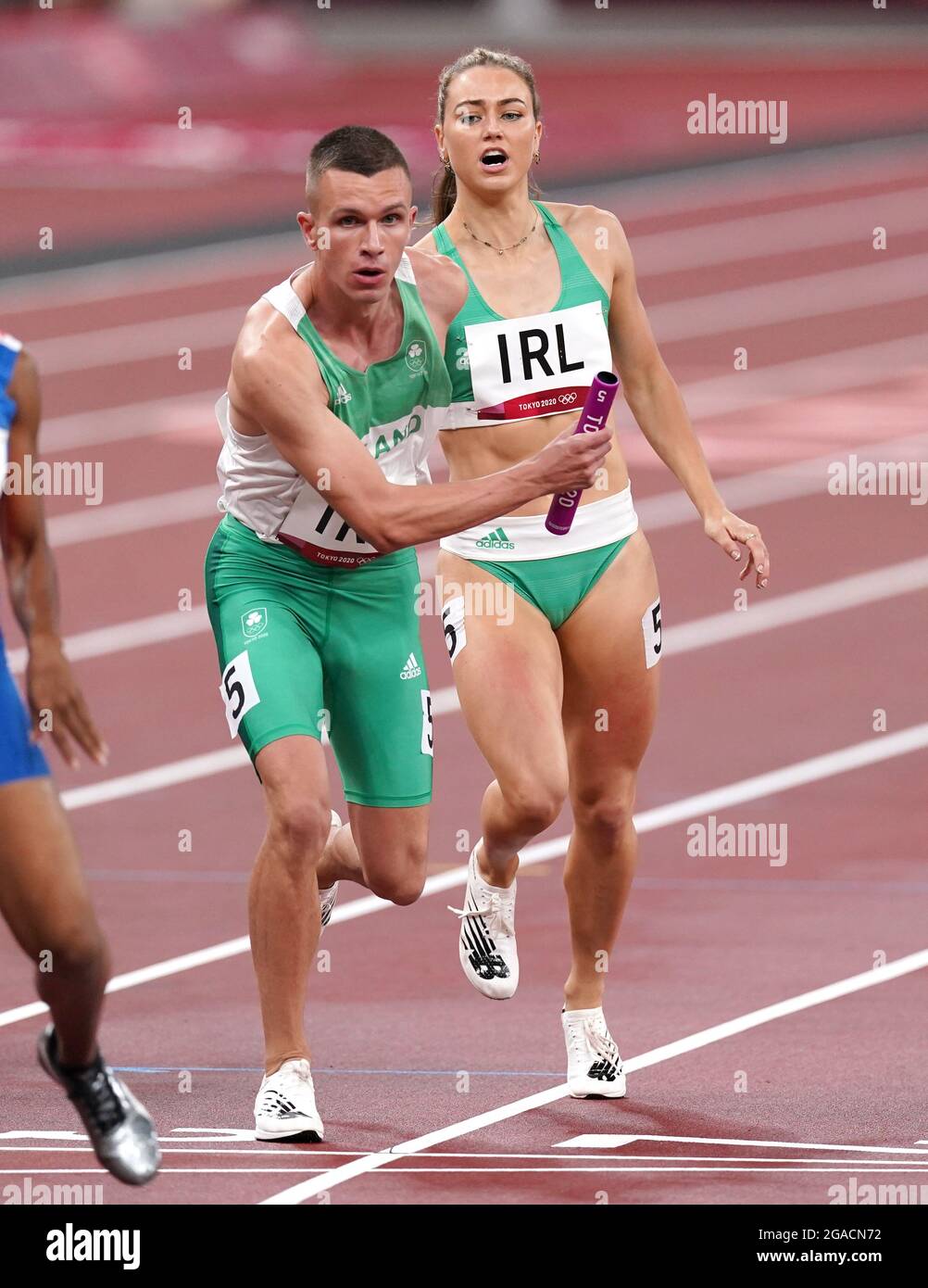 Ireland's Sophie Becker (back) hands the baton to Christopher O'Donnell