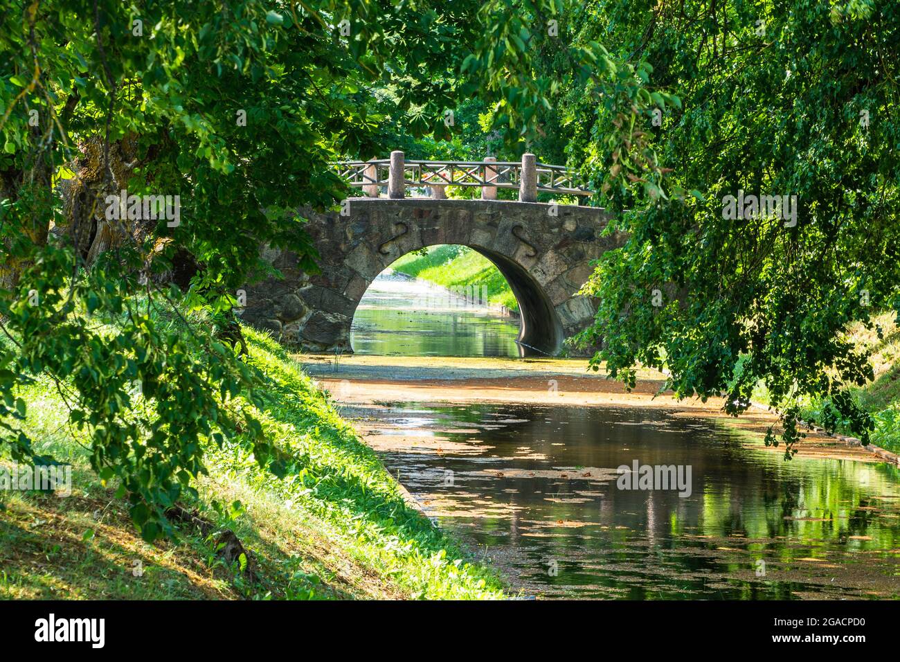 Old Stone Bridge Over the River and Lush Green Foliage Stock Photo - Alamy