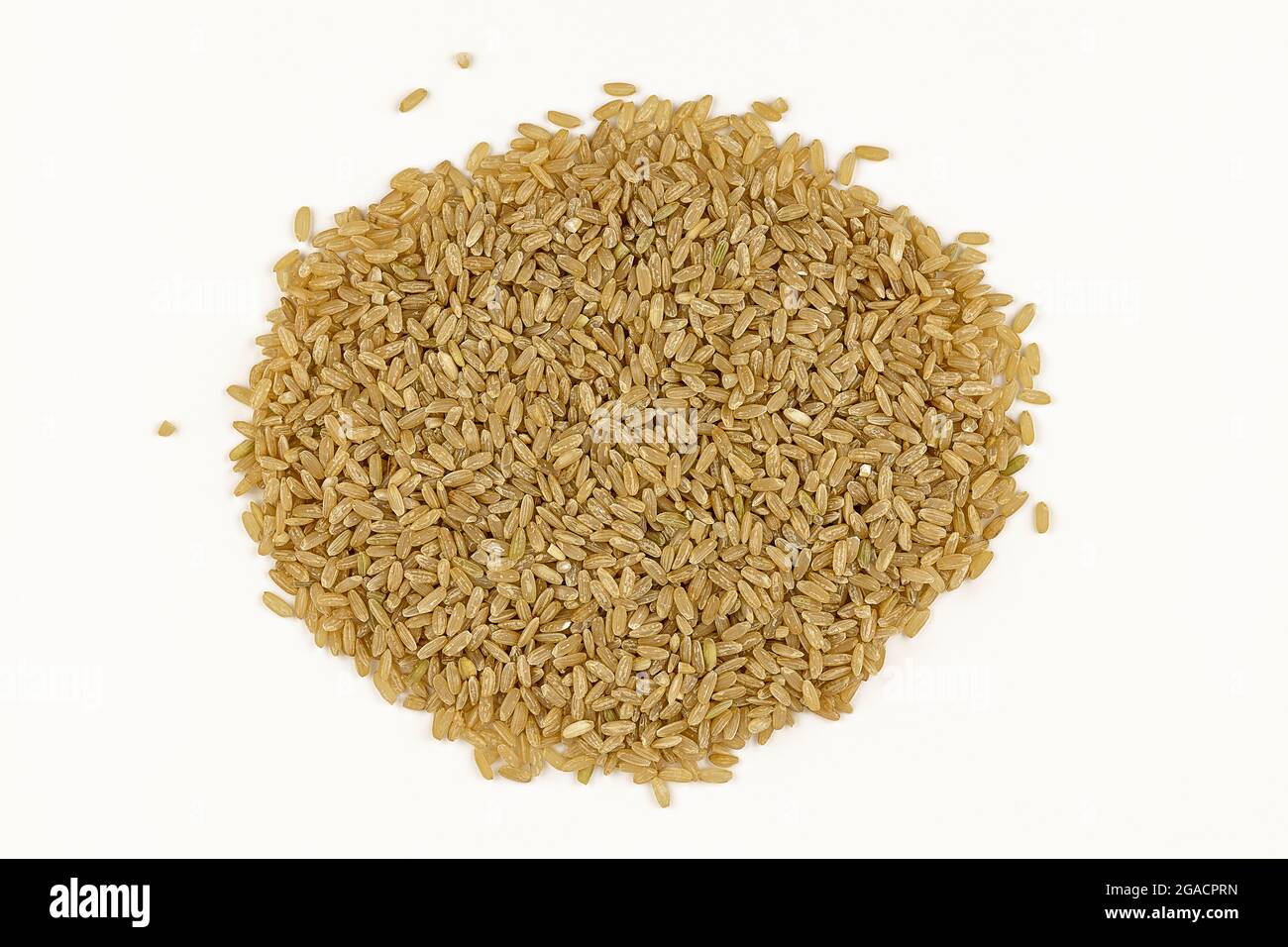 pile of brown rice on white background. top view of brown rice close-up Stock Photo