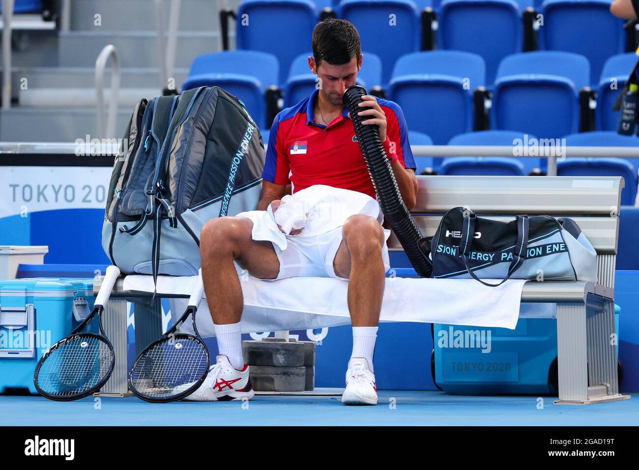 Tokyo, Japan, 28 July, 2021. Novak Djokovic tries to keep cool in the  blistering heat during the Men's Tennis Round 3 match between Novak  Djokovic of Serbia and Alejandro Davidovich Fokina on