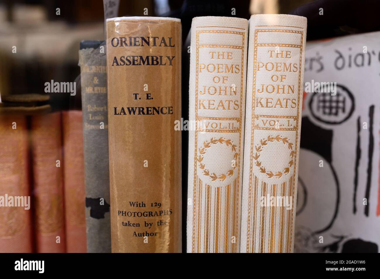 The Poems of John Keats books plus Oriental Assembly by T.E. Lawrence in a shop window. Stock Photo