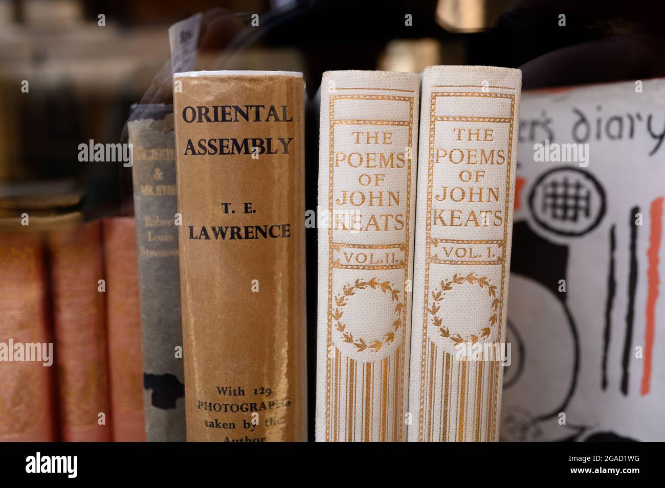 The Poems of John Keats books plus Oriental Assembly by T.E. Lawrence in a shop window. Stock Photo