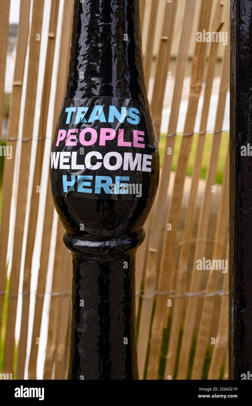 Sticker on railings saying trans people welcome here. Stock Photo