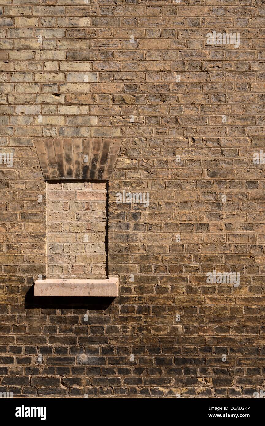 Bricked up window in a brick wall. Stock Photo