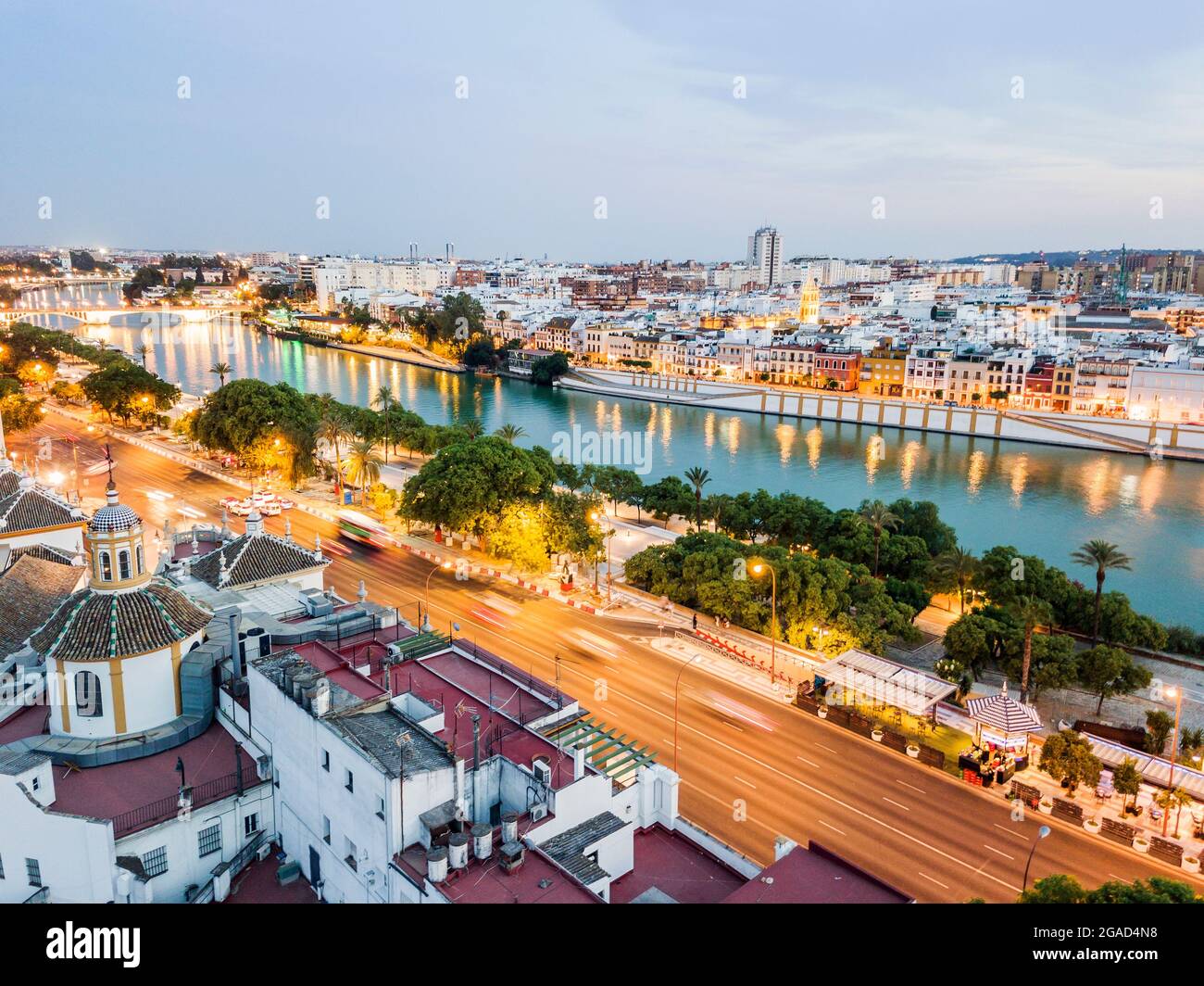 Aerial view of historic part with the river in Seville by the evening, Andalusia, Spain Stock Photo