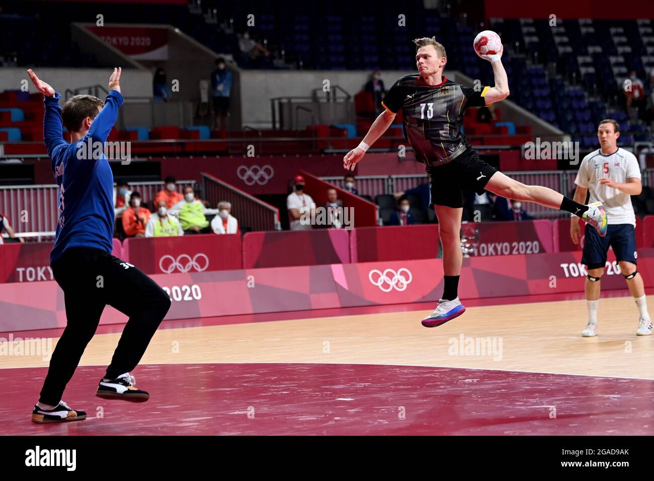 Tokyo, Japan. 30th July, 2021. Handball: Olympics, Germany - Norway, Preliminary Round, Group A, Matchday 4 at Yoyogi National Stadium. Germany's Timo Kastening (r) gets a shot on goal against Norway's goalkeeper Torbjörn Bergerud. Credit: Swen Pförtner/dpa/Alamy Live News Stock Photo