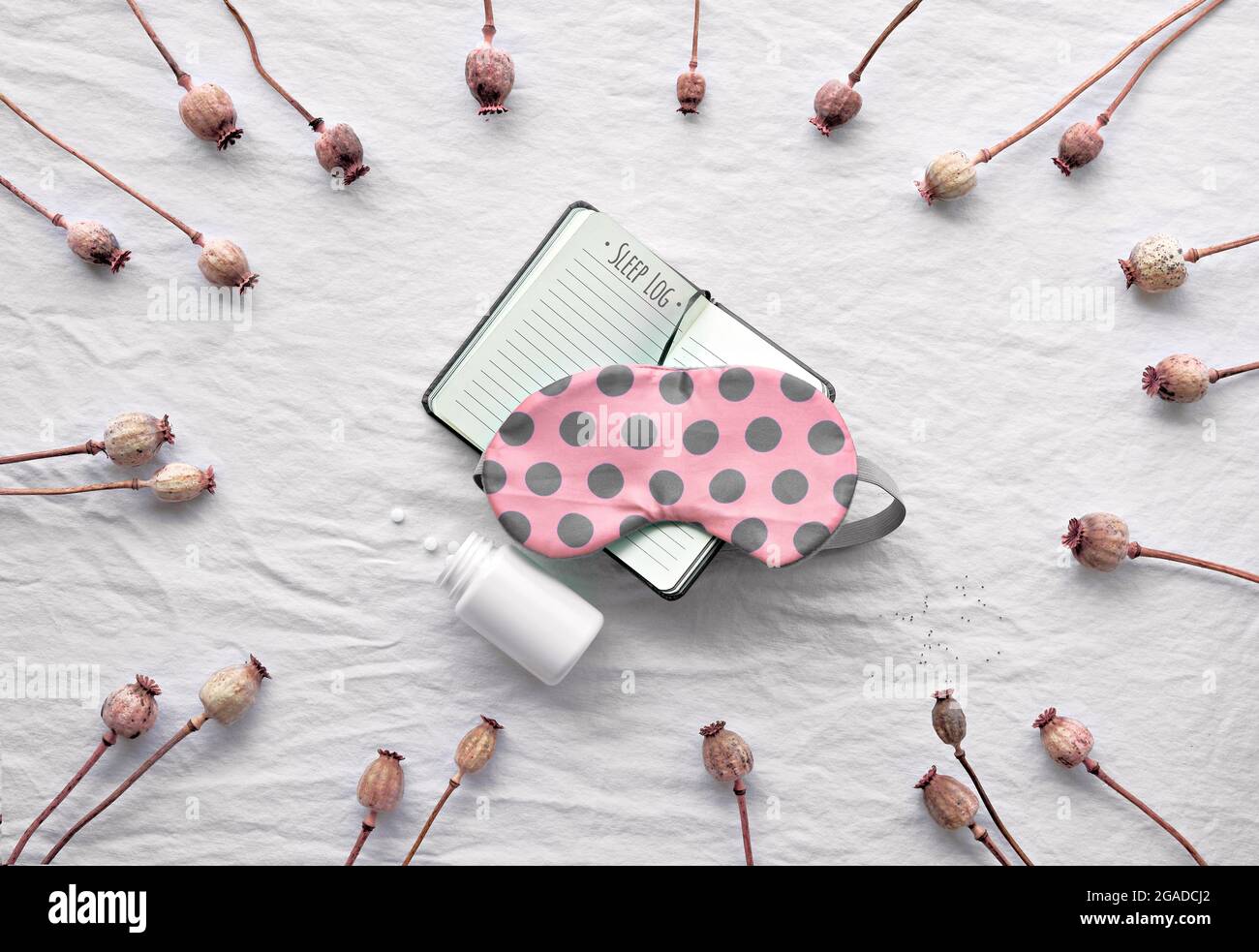 Healthy night sleep flat lay. Orange sleep mask with brown polka dots