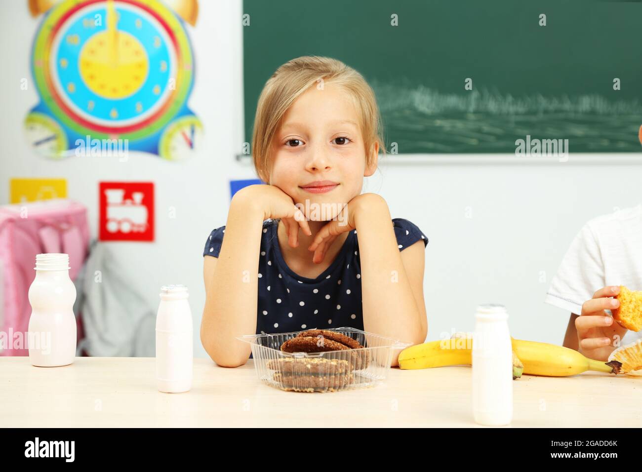 Cute children at lunch time in classroom Stock Photo Alamy